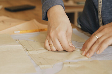 A professional fashion designer creates a new collection of clothes.