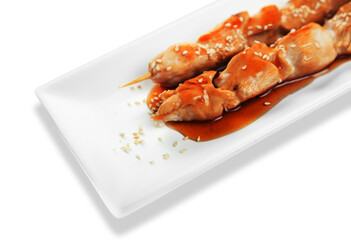 grilled chicken on bamboo skewers with a peanut dipping sauce