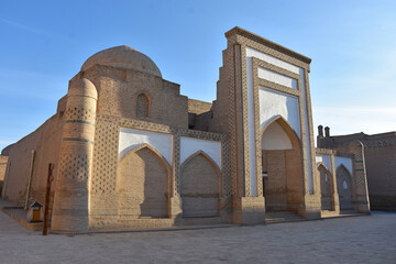 Fototapeta na wymiar White madrasah in the old city of Khiva in Uzbekistan