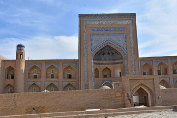Madrassah of Ala-Kuli Khan in oriental style in the old city of Khiva (Xiva) in Uzbekistan