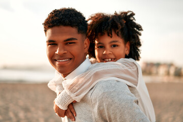 African American family on the beach on the weekend