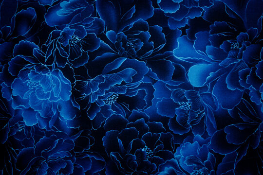 beautiful dark - royal blue vivid texture background. Fabric full of blue flowers