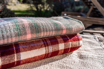 Two Different checkered colourful scarfs, Autumn and winter background. Beautiful elegant scarf in...