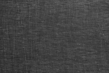 dark grey linen fabric texture background. Gray cloth textile background. Draped raw organic cloth...