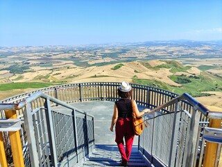 Caucasian woman at the Guglionesi viewpoint in Molise under the clear blue sky