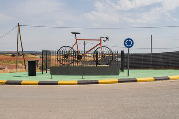 Giant metal bicycle traffic circle sculpture.