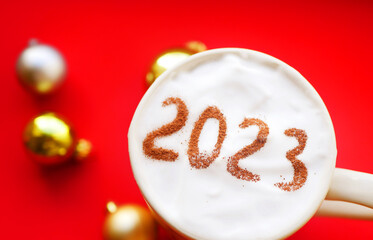 2023 on cup of coffee top view. New Year resolution. Winter holidays cozy 
