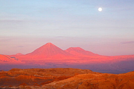 The full moon rising above the famous Valley of the Moon / Valle de la Luna near San Pedro de Atacama, Chile.