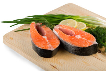 pieces of salmon and tuna fish on wooden plate isolated on white background
