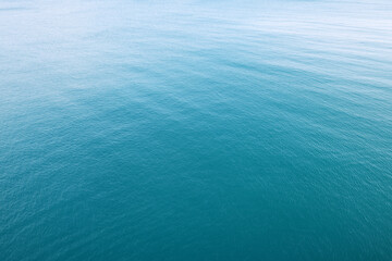 Aerial view of a clear sea water texture. Natural blue background. Blue water reflection. Mediterranean sea. 