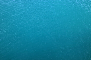 Aerial view of a clear sea water texture. Natural blue background. Blue water reflection. Mediterranean sea. 