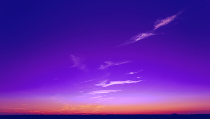 Fototapeta na wymiar Bright Dramatic Sunset Sky In Violet Colours. Amazing Beautiful Sunset View With Magenta Sky. Very Peri. Bright Purple, Yellow Colors Of Sunrise Sky Background Gradient.