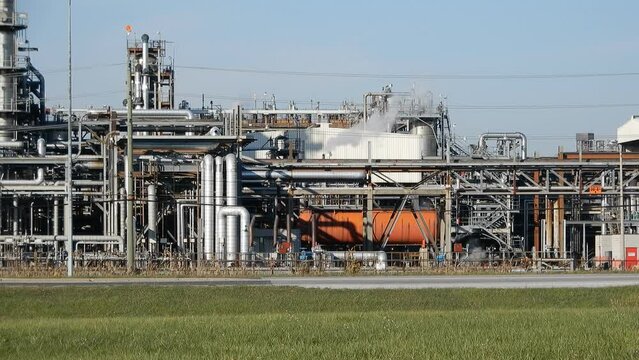 Wide Angle Industrial Chemical Oil Plant With Smoke Coming Out Of Chimney