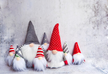 Christmas Dwarf with Red Cap and Christmas Dwarf with Gray Cap on Gray Textured Background with...