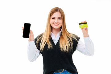 a blonde shows a smartphone and bank card on a white background. 