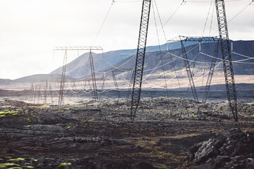 Fototapeta premium Electrical power lines running trough Iceland highlands 