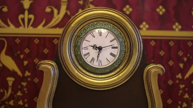 A classic mechanical alarm clock at 9.30