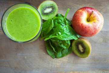 Green smoothie from spinach apples kiwi. Raw vegetarian detox alkaline food.
