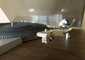Close-up of a turntable with bent arm