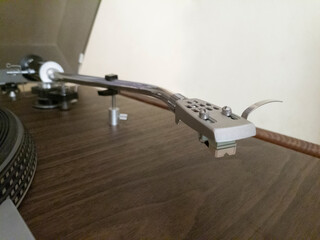 Close-up of a turntable with bent arm