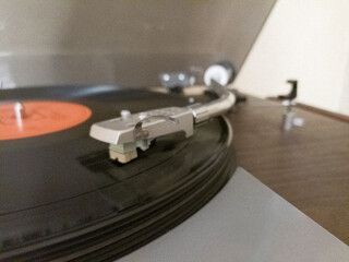 Close-up of a turntable with bent arm