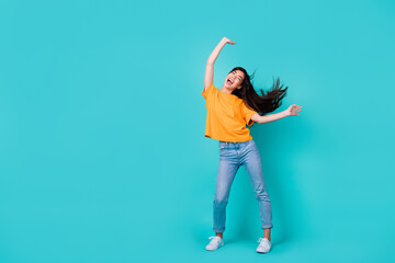 Full size photo of impressed brunette lady dance wear t-shirt jeans boots isolated on turquoise...