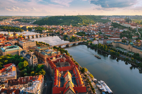 Aerial view of Vltava river and Charles bridge during sunset in Czech Republic