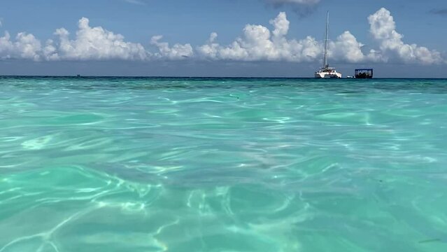 Azure water of the Indian Ocean against the blue sky. Recreation and tourism concept. Horizontal video