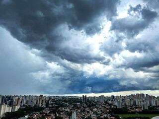 Dark and dramatic rain clouds over a city. Sao Paulo city, Brazil.
