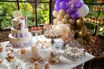 Table of desserts and sweets at the first communion party
