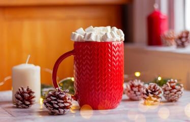 red cup with marshmallow on the table. winter holidays, Christmas, New Year