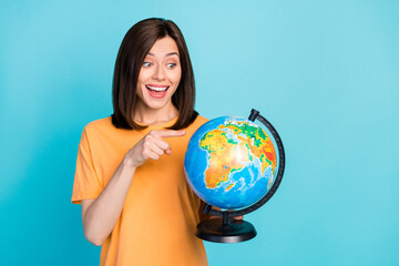 Portrait of positive impressed astonished woman long hairstyle yellow t-shirt look directing at...