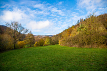 Fototapeta na wymiar Panorama of a hilly landscape in autumn