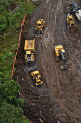 PNG-LNG project -aerial image of heavy machinery constructing the beginning of the Northern Highlands gas project in Papua New Guinea.