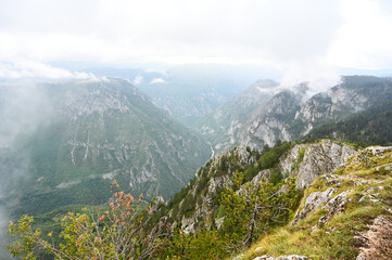Fototapeta na wymiar Tara river canyon and Durmitor mountain. Fog on the mountain. Montenegro.