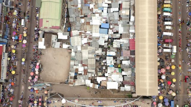 Aerial top view shot of Slam market Kumasi Accra Ghana with a lot of people and buildings
