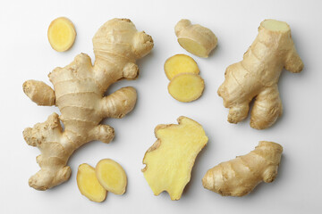 Fresh ginger on white background, flat lay