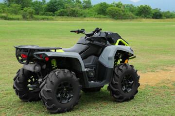 Modern quad bike on green grass outdoors