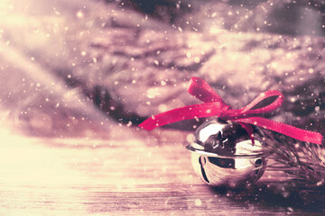 Shiny silver sleigh bell on wooden table. Space for text - obrazy, fototapety, plakaty