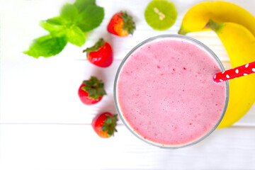 Strawberry mix banana smoothies juice beverage healthy the taste yummy In glass drink episode morning on wooden background from the top view.