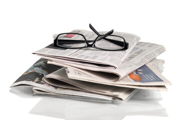 Closeup of Newspapers with Eyeglasses