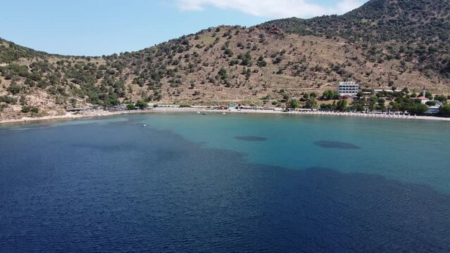 Izmir, Turkey - June 7, 2022: Aerial view of Denizkoy beach with eos camping area with drone.