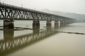 The Qiantang River Bridge in the fog.