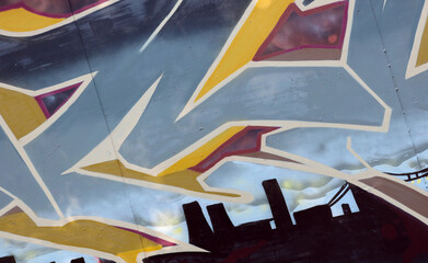 Colorful background of graffiti painting artwork with bright aerosol strips on metal wall. Old...