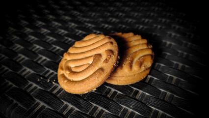 Brown biscuits on a black background.