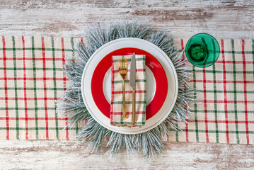 Top view of a stylish red and green holiday table setting