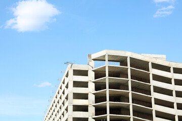Construction site with unfinished building on sunny day