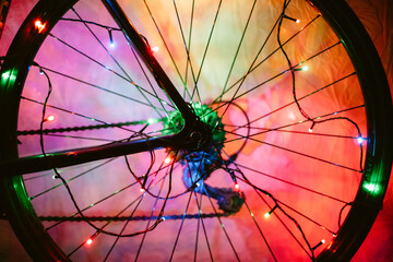 Bicycle wheel decorated with Christmas lights