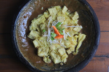 Egg tofu is a dish typical of East Java, Indonesia, which consists of fried tofu covered in beaten egg.  usually consumed with the addition of peanut sauce