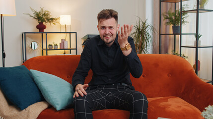 What. Why. Young bearded man raising hands in indignant expression, asking reason of failure,...